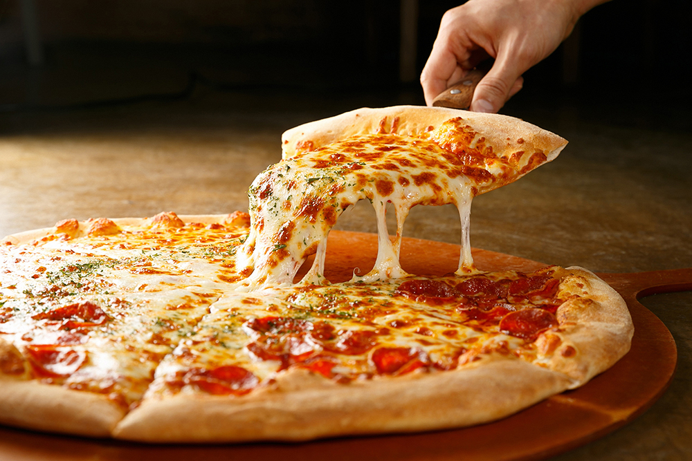 pepperoni pizza on wooden board